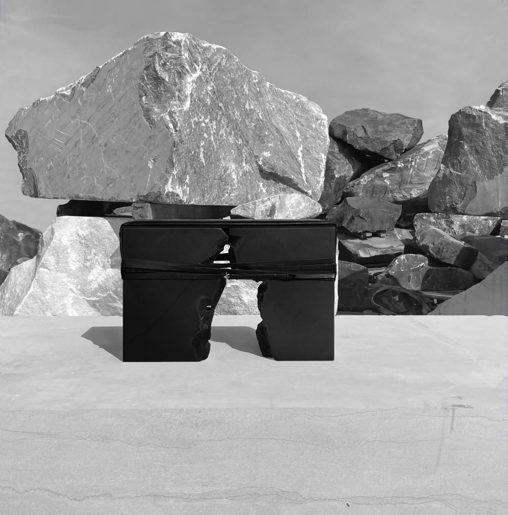 Sculptural stone bench by Isac Elam Kaid split along a natural fault line and bound with leather straps and silver clasps.