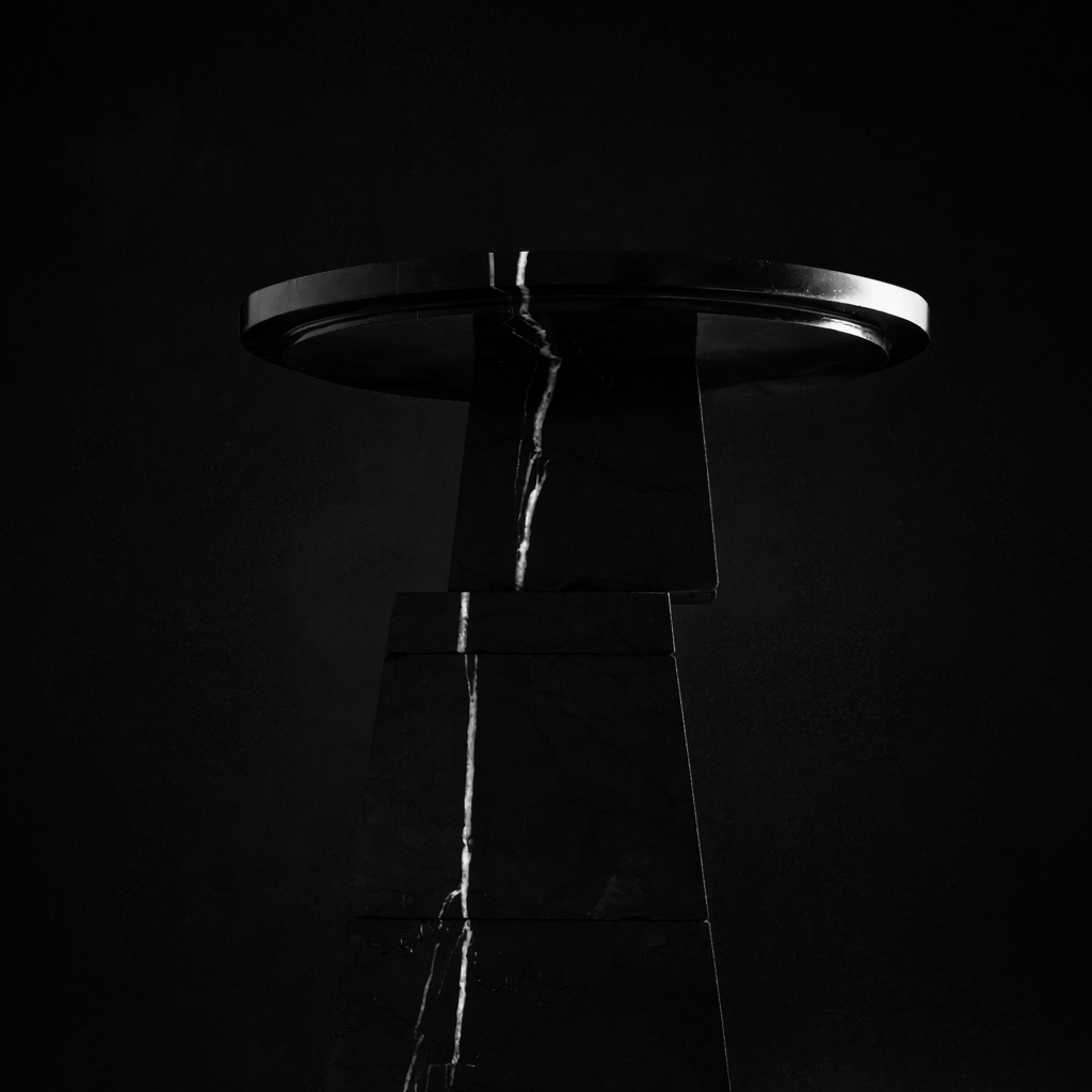 Sculptural stone pedestal table by Isac Elam Kaid composed of fractured stone pillars.