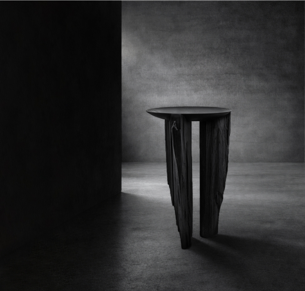 Ebonized reclaimed timber table with fractured wood supports by sculptor Isac Elam Kaid